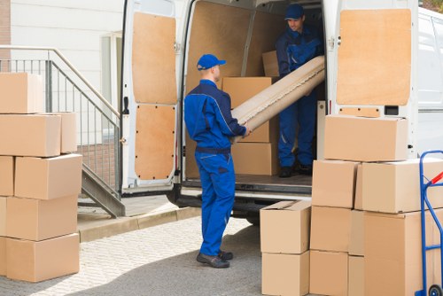 Moving van service navigating a residential street in Belsize Park