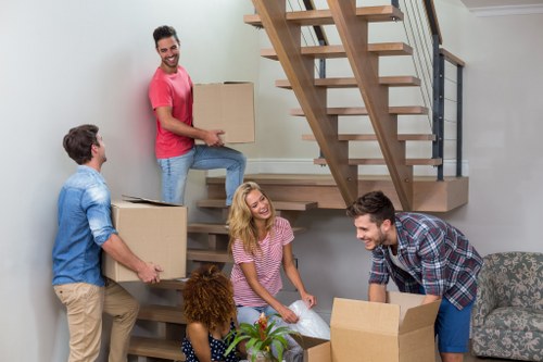 Van moving team preparing a safe relocation with protective equipment