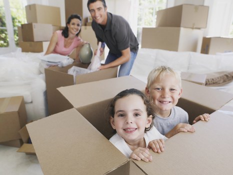 Packed office boxes and furniture ready for relocation in North West London
