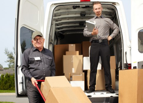 House removalists preparing a moving van in Belsizepark