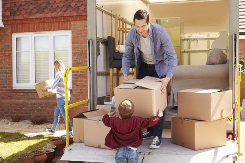 Loading furniture into a van for a Belsizepark move