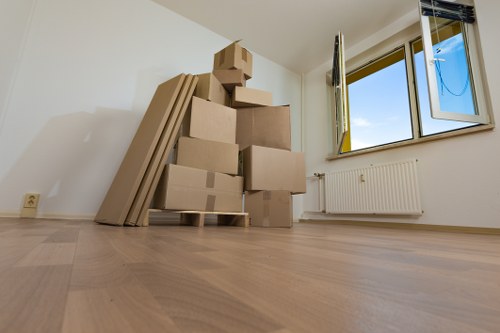 Same day removals team handling urgent moving boxes in Belsize Park