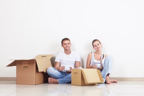 Professional movers handling furniture in Belsize Park