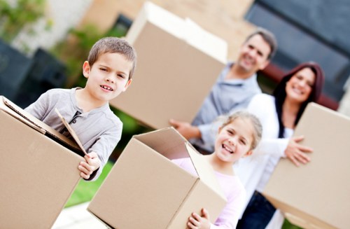 Mover handling mixed household items for a cubic-yard priced relocation in Belsize Park