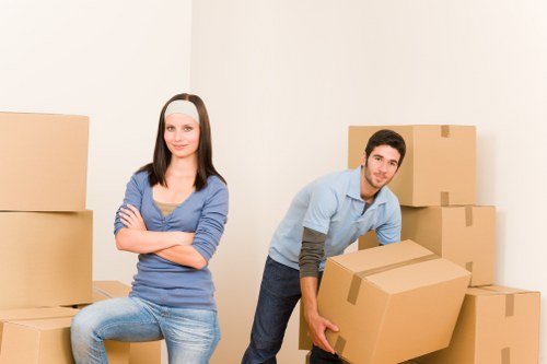 Packed moving boxes prepared for home relocation in Belsizepark