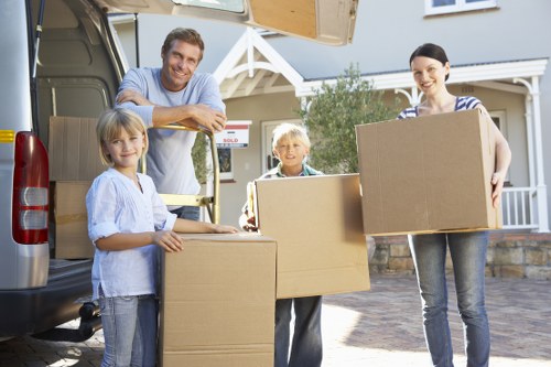 Moving crew organizing a residential relocation in Belsize Park