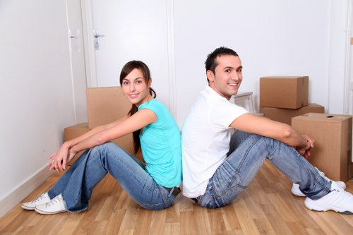 Professional team loading furniture for disposal in Belsizepark