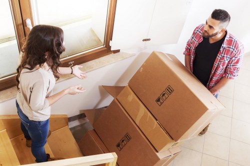 Furniture and packing supplies ready for a Belsizepark house move
